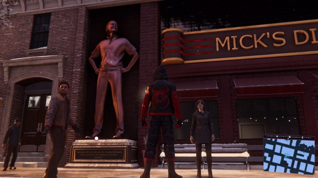 Bronze statue of Stan Lee outside Micks Diner in the video game Spider-Man: Miles Morales