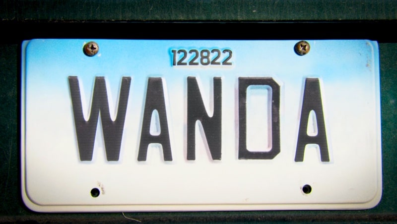 License plate with the word Wanda and the numbers 122822 on top from the Disney+ show WandaVision