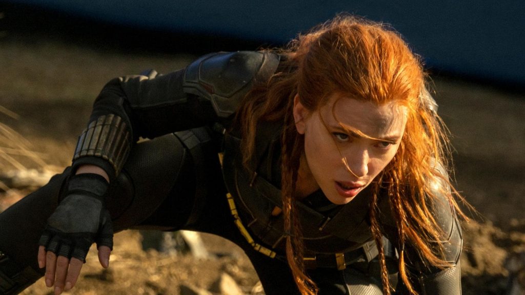 Scarlett Johansson crouches down in a black uniform in Black Widow