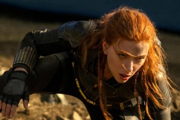 Scarlett Johansson crouches down in a black uniform in Black Widow