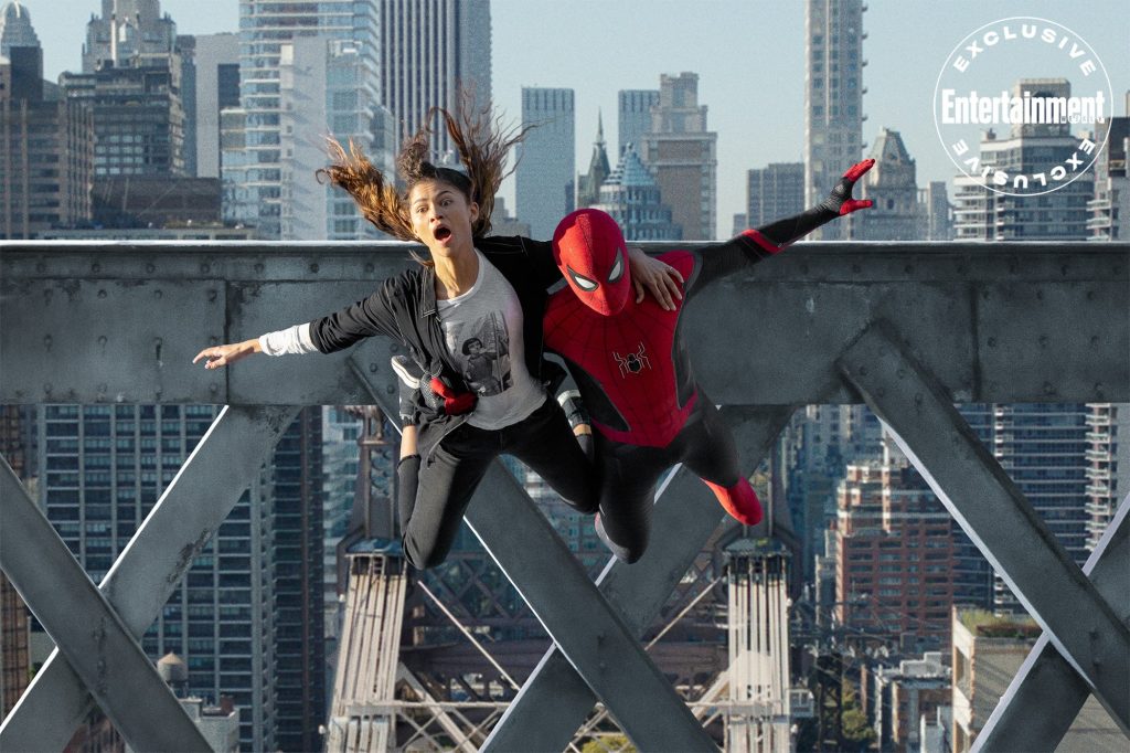 Spider-Man and MJ leap from a steel ledge in Spider-Man: No Way Home