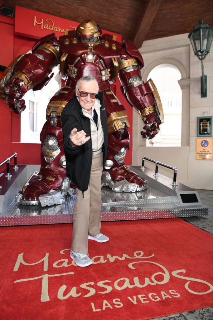 Stan Lee stands in front of Madame Tussauds Hulkbuster figure at a 2017 event at the museum in Las Vegas.