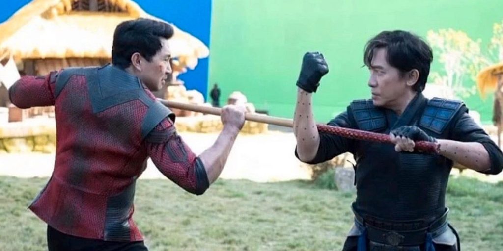 Behind the scenes of a Shang-Chi fight scene with Simu Liu in red and Tony Leung in blue.