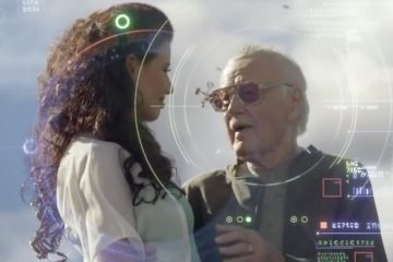 Stan Lee speaking to a woman in white