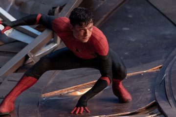 Tom Holland crouching in a red and blue suit as Spider-Man in Spider-Man: No Way Home